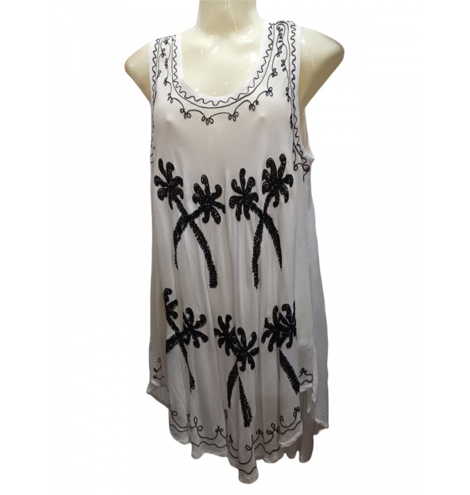 Blusa blanca y negra con palmeras